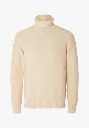Beige polokragetröja i stickat tyg, med ribbade ärmar och nederkant, med en mjuk textur och en avslappnad passform.