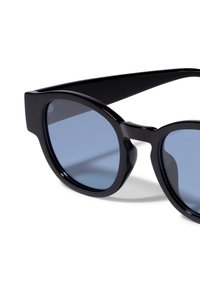 Black acetate sunglasses with rounded frames and blue lenses. The design features thick arms and a smooth, glossy finish.