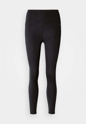 Collants de sport noirs avec une taille haute, une texture lisse et sans coutures visibles, conçus pour le confort et la flexibilité pendant l'exercice.