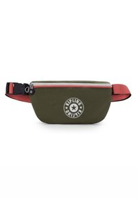 Sac de taille vert olive en tissu durable, avec une fermeture éclair blanche, une sangle corail et un logo Kipling circulaire avec un motif d'étoile.