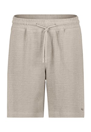 Beige textured knit shorts with elastic waistband and drawstring, featuring two side pockets and a small branded patch near the hem.