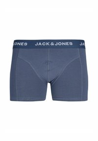 Boxer da uomo in colore blu scuro con logo bianco "JACK & JONES" sulla cintura. Presenta un tessuto liscio e cuciture rinforzate.