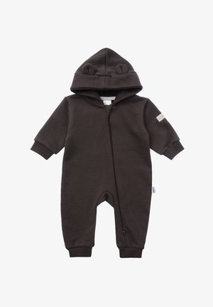 Brown fleece onesie with bear ears on hoodie, front zipper, ribbed cuffs, and a small label on the left sleeve. Soft, warm fabric.