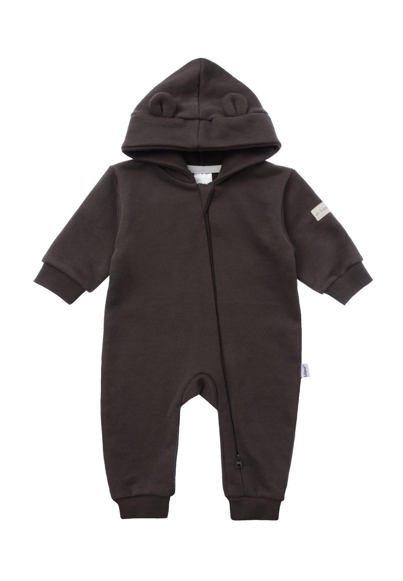 Brown fleece onesie with bear ears on hoodie, front zipper, ribbed cuffs, and a small label on the left sleeve. Soft, warm fabric.