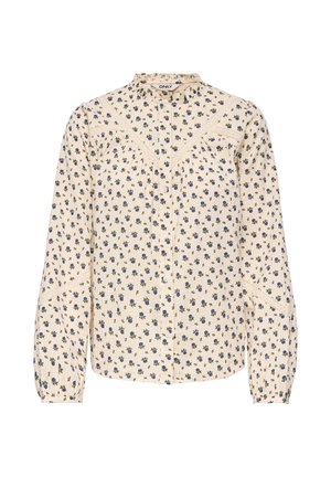 Blouse crème à manches longues avec petit imprimé floral bleu et vert, fermeture boutonnée à l'avant, col montant et détails en dentelle aux épaules et aux manches.
