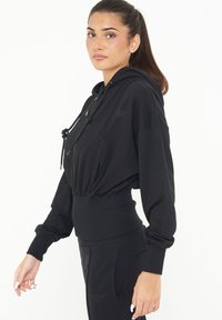 LEGEA TRIXY - Felpa con zip - nero