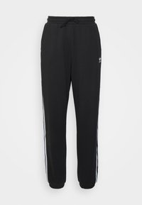 Black adidas sweatpants with elastic waistband, ankle cuffs, white side stripes, and small logo on upper left thigh.