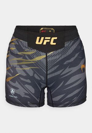 Sorte og grå MMA-bukser med et gyldent "UFC"-logo, dynamiske stribe mønstre, glat stof og elastisk talje.