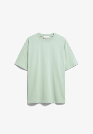 Effen lichtgroen oversized T-shirt met korte mouwen, ronde hals en een Arnedangels-label aan de binnenzijde van de achterkant van de kraag.