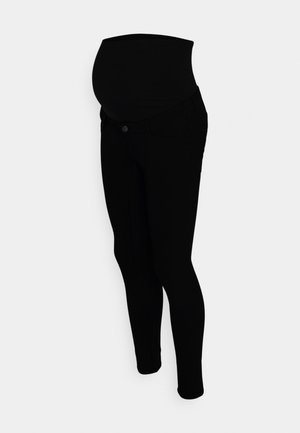 Svarte gravide jeans har et elastisk panel som går over magen, slim fit og standard fem-lommersdesign. Glatt tekstur og minimale detaljer.