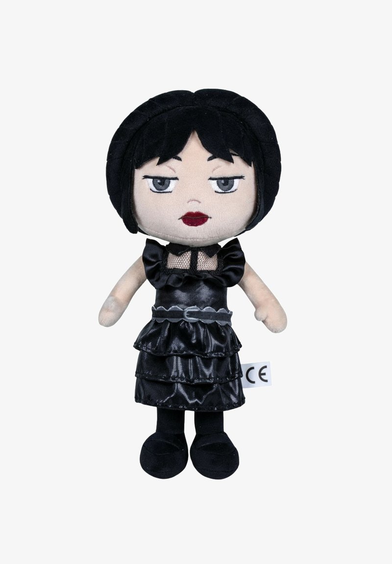 Poupée en peluche noire avec une jupe superposée à volants, un détail en maille et des traits du visage cousus. Cheveux courts noirs et chaussures noires. Étiquette avec marquage CE.