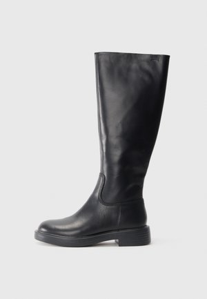 Tall black leather boot with low heel and rounded toe, side view on white background.