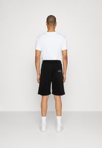 Carlo Colucci UNISEX - Træningsbukser - schwarz