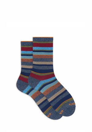 Striped socks featuring blue, red, green, and orange hues. Soft fabric with a textured finish and contrasting cuff. Durable construction.