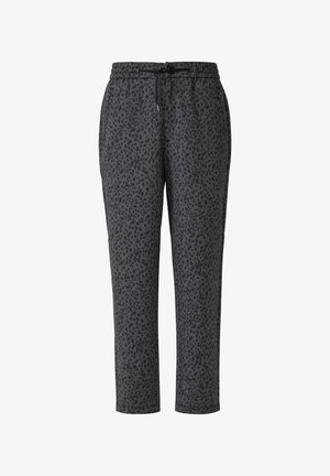 Sivé tepláky s čiernym leopardím vzorom, elastickým pásom s šnúrkou na stiahnutie, zúženými nohavicami a bočnými vreckami.