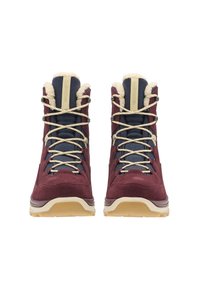 Bordeaux en marine hiking boots met een zachte bontvoering, opvallende oogjes en beige veters. Beschikt over een dikke, gestructureerde rubberen zool.