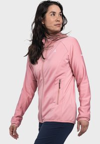 Giacca rosa con zip, dal tessuto a costine, colletto alto e tasca laterale con zip. Presenta il logo sulla spalla e un design aderente.