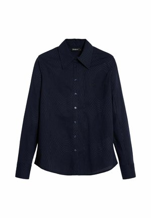 Navy button-up shirt with a textured pattern of concentric circles, long sleeves, and a pointed collar. Features matching buttons and a logo detail.