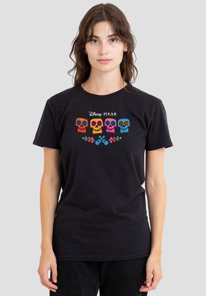 Black cotton t-shirt featuring colorful, embroidered sugar skulls and floral accents. Round neckline and short sleeves.