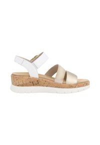 Wedge sandals with white and beige straps, featuring a textured surface and cork midsole, set on a white rubber sole.