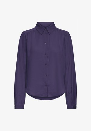 Lila Bluse mit langen Ärmeln und Kragen, vorn mit Knöpfen und einem leicht geschwungenen Saum. Glattes Material mit einem leichten Glanz.