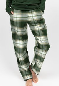 Pantaloni a scacchi verdi e bianchi con accenti grigi. Taglio morbido con tasche laterali e distintivo motivo a scacchi. Tessuto morbido al tatto.