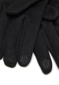 Schwarze Strickhandschuhe mit touchscreen-kompatiblen Stoffpatches an den Zeigefingern auf einem weißen Hintergrund.