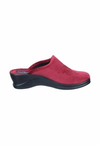 Red suede slip-on shoe with a curved black wedge heel and floral embroidery detail on the upper. Soft texture and casual design.