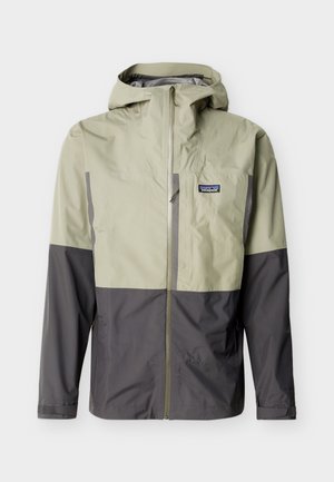 Tofarget beige og mørkegrå hettejakke med glidelås foran og Patagonia-logo på venstre bryst.