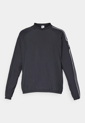 Veste pull noire en tissu léger, avec un col rond, des poignets élastiques et des bandes blanches sur les côtés pour l'accent.