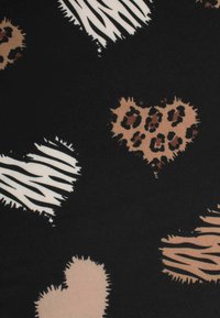 Black fabric featuring a pattern of varied heart shapes in beige, animal print, and white striped designs, with fuzzy texture accents.