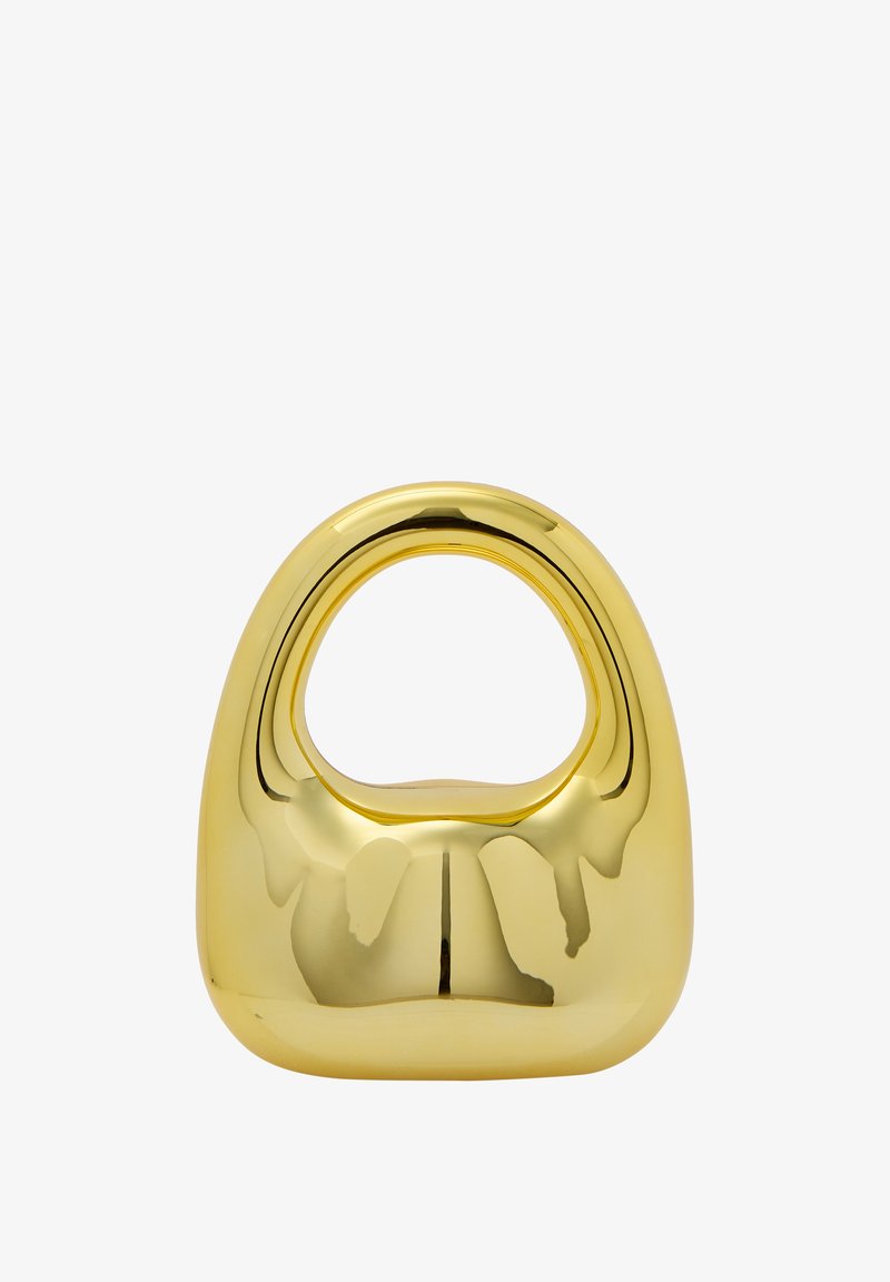 Guldcolorerad skulptural objekt med en rundad bas och en avlång, oval öppning upptill, med en slät, reflektiv yta.