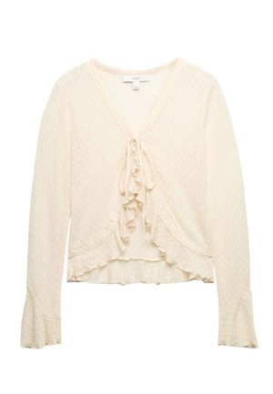 Cremefarvet blonder cardigan med lange ærmer, flæsekant og bindebånd foran, med et subtilt diamantmønster og let udvidede manchetter.