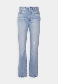 Jean en denim bleu clair à taille haute avec une légère coupe évasée. Doté d'une fermeture à boutons sur le devant, de cinq poches, et d'un détail usé au niveau du genou.