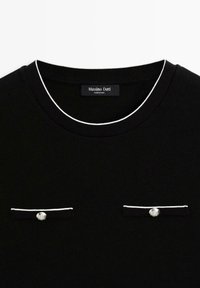 Black knit t-shirt with a round neck, white piping, and two front pockets adorned with silver buttons. Label: Massimo Dutti.