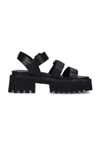 Sandali neri con suola piatta e spessa, realizzati in pelle liscia. Presentano ampie cinghie a croce e un fondo testurizzato con scanalature per una migliore aderenza.