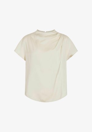 Blouse crème à manches courtes en tissu lisse. Caractérisée par un col haut avec un drapé sur une épaule et une fermeture dans le dos.