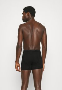 Calvin Klein Underwear TRUNK 3 PACK COTTON STRETCH - Cuecas boxer - black