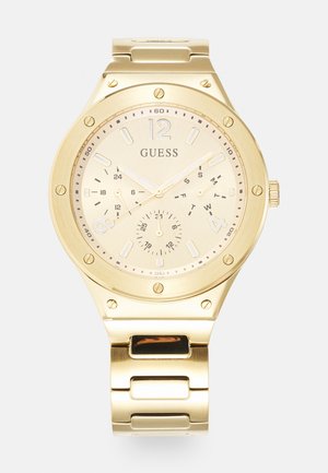 Goldfarbene Uhr mit rundem Gehäuse, beigem Zifferblatt, ausgeprägten Stundenmarkierungen und einem miteinander verbundenen Metallarmband. Verfügt über einen Nebenzifferblatt und ein Datumsdisplay.