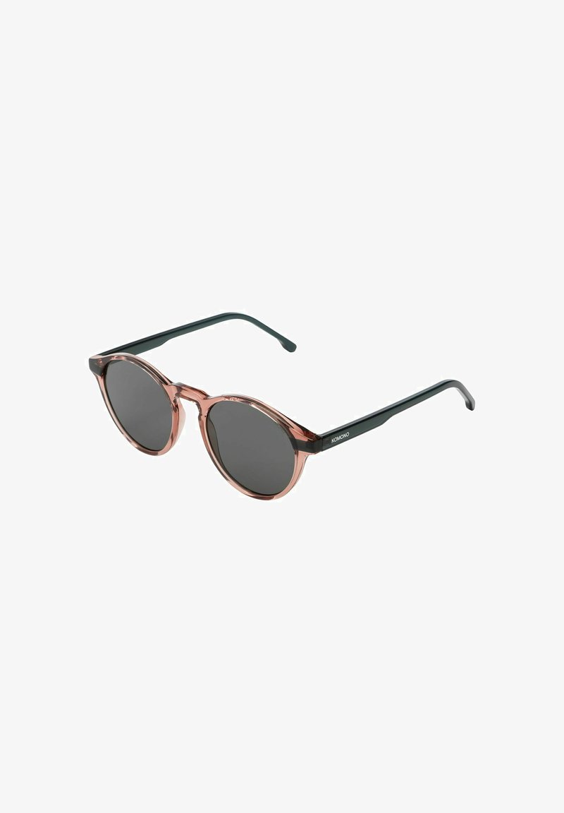 Occhiali da sole rotondi con montatura trasparente rosa e lenti scure. Le astine nere presentano un design semplice con un'iscrizione del logo.