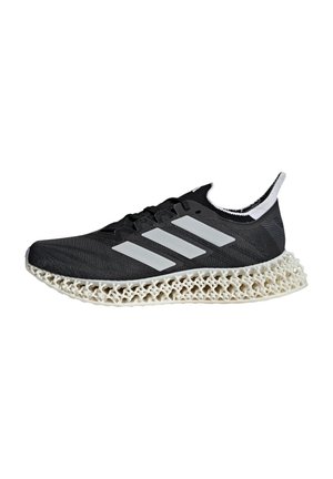Black athletic shoe with a textured upper, featuring white stripes, and a distinctive lattice-style sole in cream color.