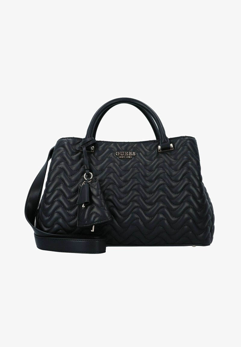 Sac à main noir matelassé avec un motif texturé en vagues, des accents en métal argenté, des poignées doubles et une bandoulière réglable. Comprend un charm.