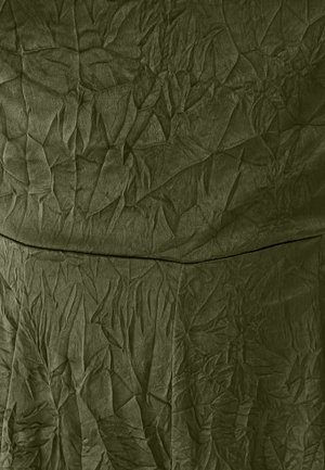 Crinkled olive green fabric with a textured surface, displaying prominent folds and irregular lines throughout. Flat at the top with no visible seams.