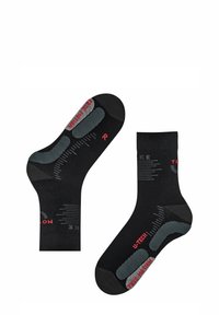 Calzini neri con accenti grigi, dotati di modelli di grip testurizzati sulla suola e branding rosso. Progettati per comfort e stabilità.