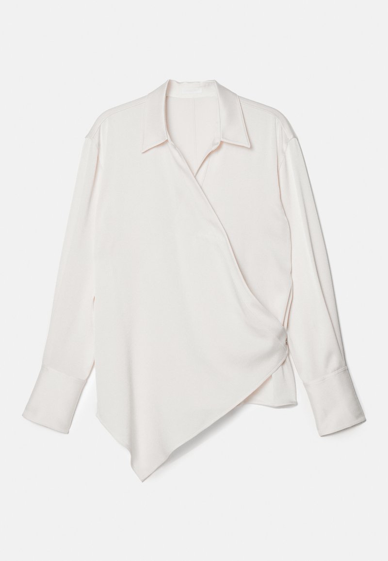 White long-sleeve wrap shirt with a pointed hem, made of smooth fabric, featuring a classic collar and cuffed sleeves.