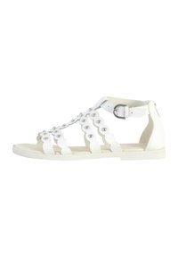 Sandal in pelle bianca con suola piatta, punta aperta e intricato design a intagli circolari con accenti in metallo. Cinturino alla caviglia con chiusura a fibbia.