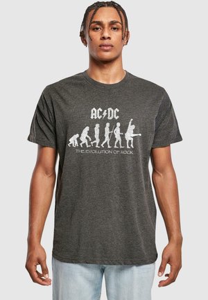 Gray cotton t-shirt featuring a white graphic print of a human evolution sequence and the text "AC/DC - The Evolution of Rock."