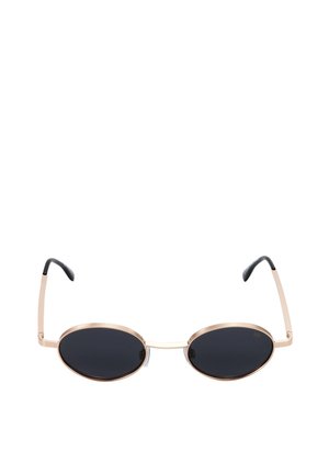 Lunettes de soleil ovales avec verres noirs et fines montures en métal doré, avec embouts noirs sur les branches incurvées.