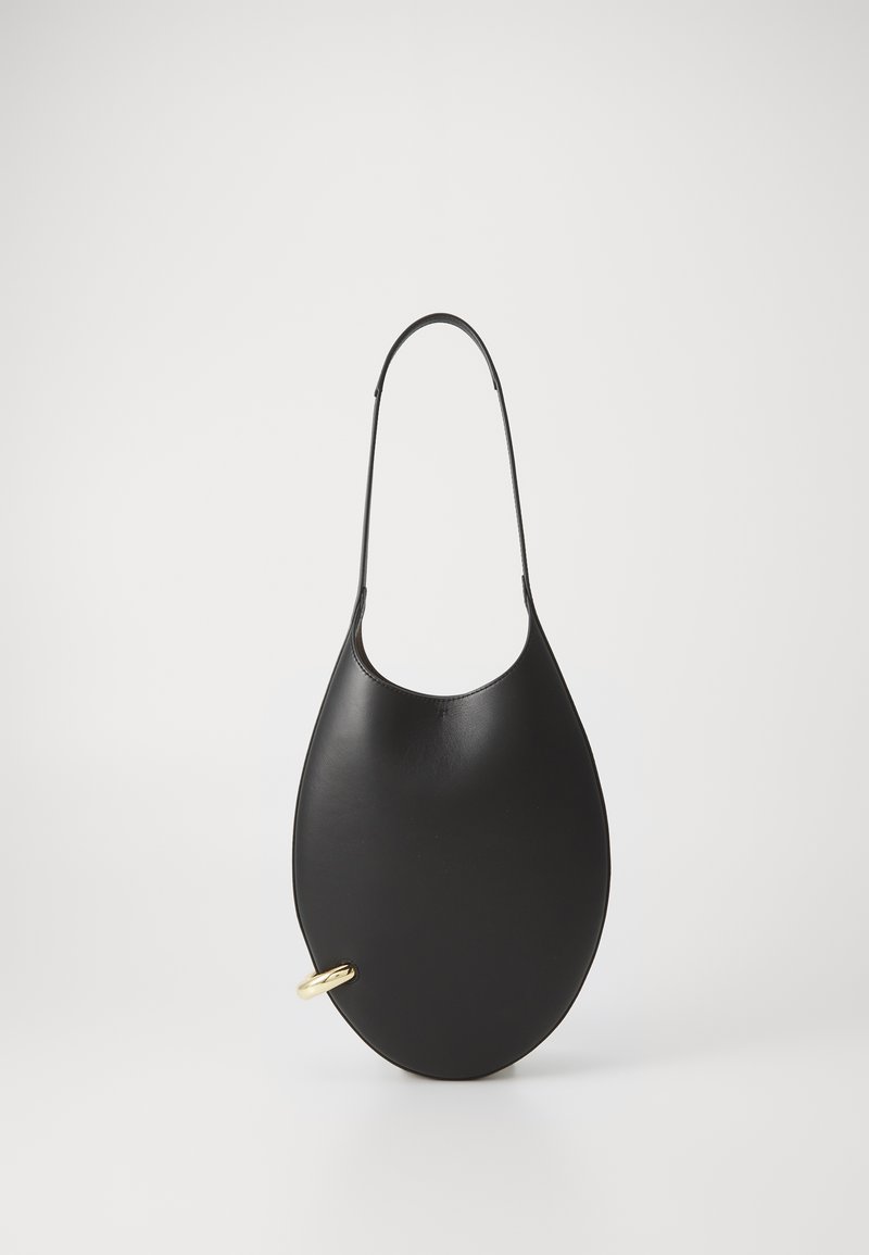 Black leather handbag with an elongated teardrop shape, featuring a thin strap and a gold hardware accent. Smooth texture.