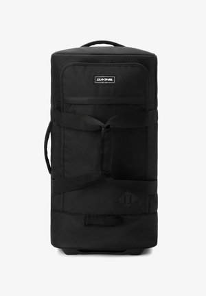 Borsa da viaggio nera su ruote con tessuto resistente, manico superiore, cinghie laterali e forma rettangolare. Presenta un'etichetta con il logo e una base liscia.